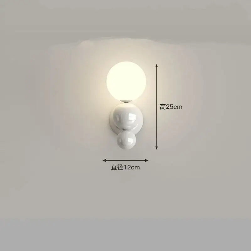 White ceramic decorbites led wall sconce with three stacked spherical globes for modern kids room lighting
