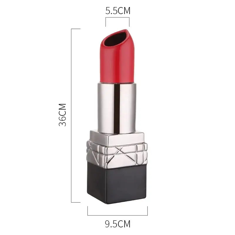 A vibrant red decorbites lipstick shape ceramic vase with a sleek silver and black case for living room floral decor
