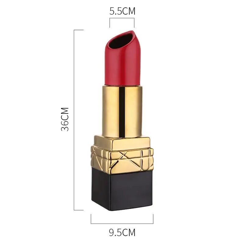 A glossy red decorbites lipstick shape ceramic vase with a gold and black embossed diamond pattern cap for living room decor