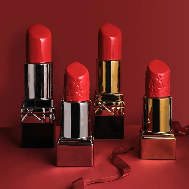 Four vibrant red lipstick shape ceramic vases with metallic embossed star caps for modern living room decorbites decor