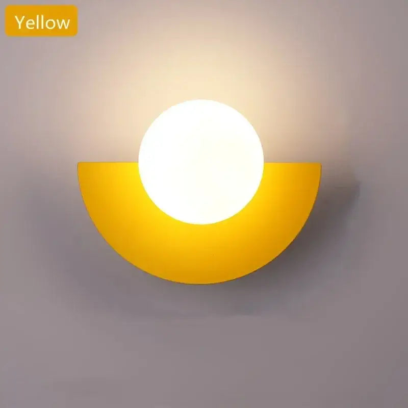 Yellow semi-circular wall lamp with a glowing white glass ball led bulb for modern bedroom decorbites ambient light