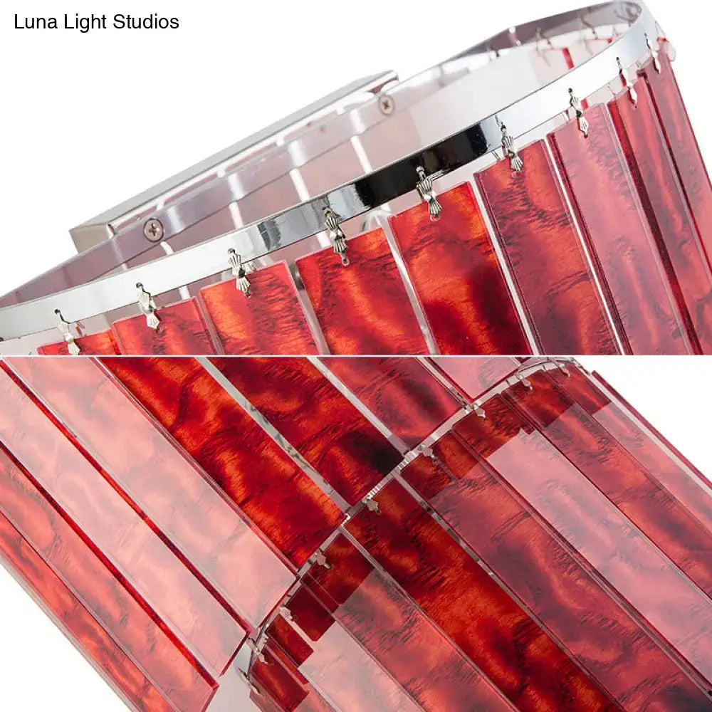 Modern red prism wall mounted light with vibrant acrylic panels and chrome clips stylishly enhances living room decor
