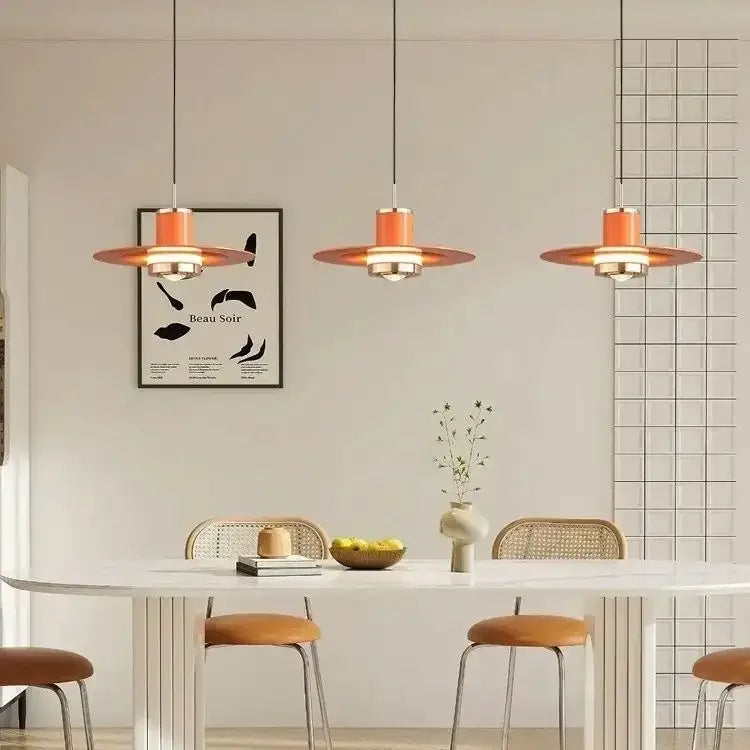 Modern red colorful umbrella pendant lamp with warm orange circular shades and metallic fixtures for dining room decorbites decor