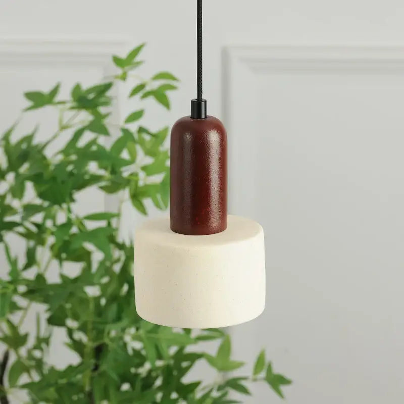 Modern cylinder led pendant with rich reddish brown wooden top and cream matte cement cylinder led base decorbites cement cylinder