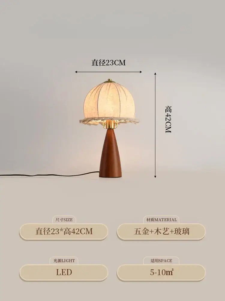 A warm-toned dome-shaped table lamp with gold lustre wood base and gold-tone accents from decorbites gold lustre