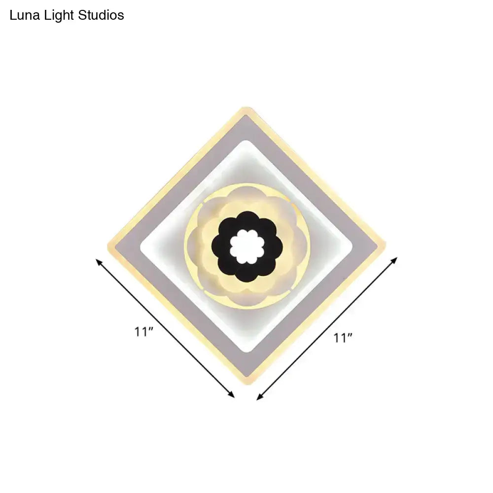 Modern rhombus bloom pattern sconce light with beige white gray layers and central black floral bulb base for study