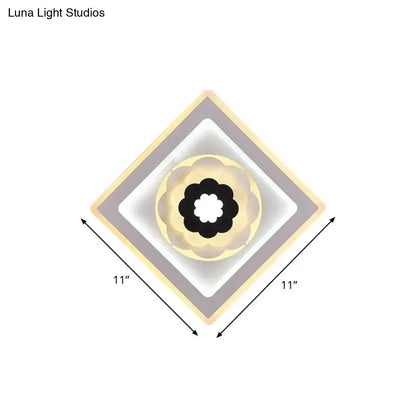 Modern rhombus bloom pattern sconce light with beige white gray layers and central black floral bulb base for study