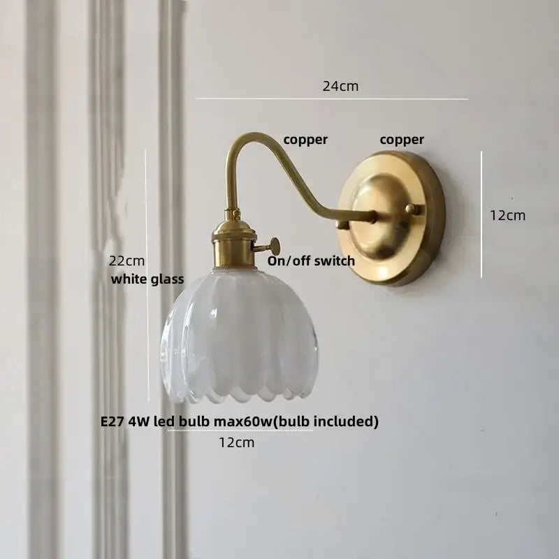 Modern wall sconce with glass copper knob switch featuring a vintage brass copper finish and scalloped white glass shade