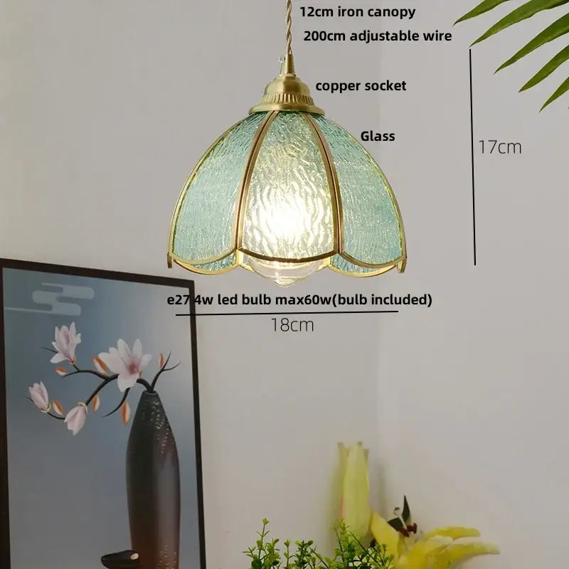 Modern ribbed blue glass led pendant light with teal glass, brass frame, and adjustable copper socket for kitchen decorbites blue glass