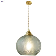 Modern ribbed blue glass led pendant light with translucent spherical design and brass metal hardware by decorbites