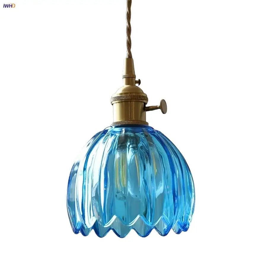 Modern ribbed blue glass pendant light with brass fixture for dining room featuring decorbites blue glass led design