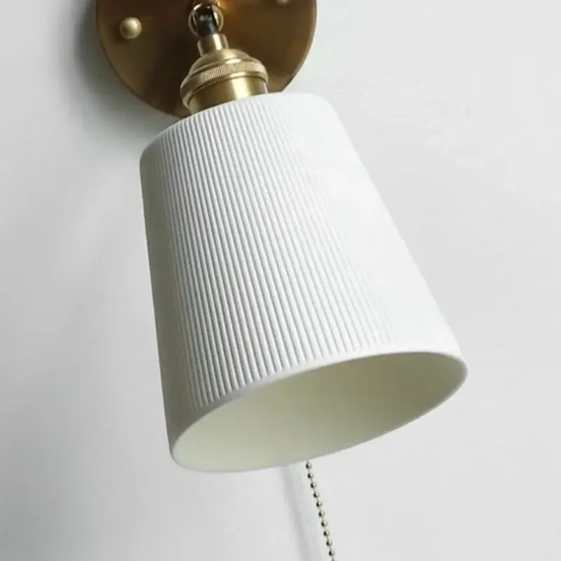 Modern ribbed white ceramic led wall light with brass arm and hardware for bedroom decorbites ceramic led wall lighting