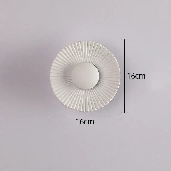 Modern ribbed circular white ceramic plate with fluted design and raised center for elegant led wall lamps lighting
