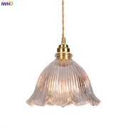 Modern ribbed clear glass pendant light with brass fixture and twisted copper cord from decorbites clear glass collection