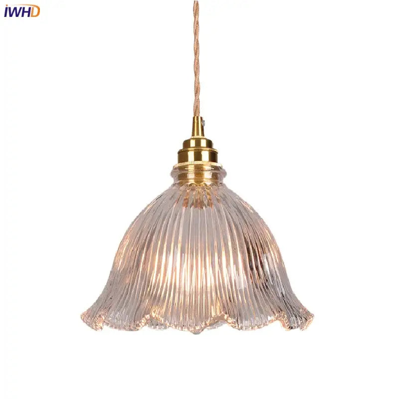 Modern ribbed clear glass pendant light with brass fixture and twisted copper cord from decorbites clear glass collection