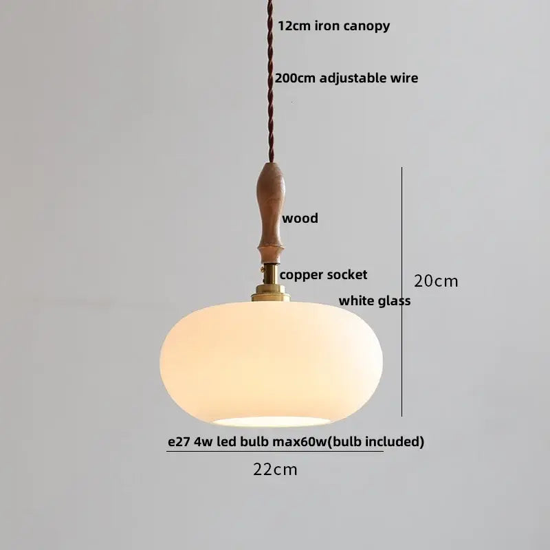 A warm glowing pendant lamp with copper white glass shade and wood iron canopy perfect for modern decorbites decor