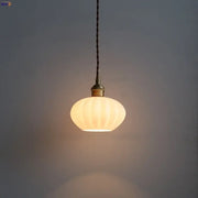 Modern ribbed copper white glass pendant lamp with warm-toned glass and brass fixture for living room decorbites decor