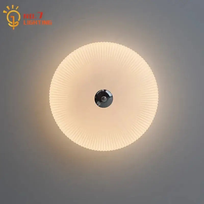 Modern ribbed cream glass round ceiling lights featuring a black central fixture for bedroom led lighting decorbites cream glass