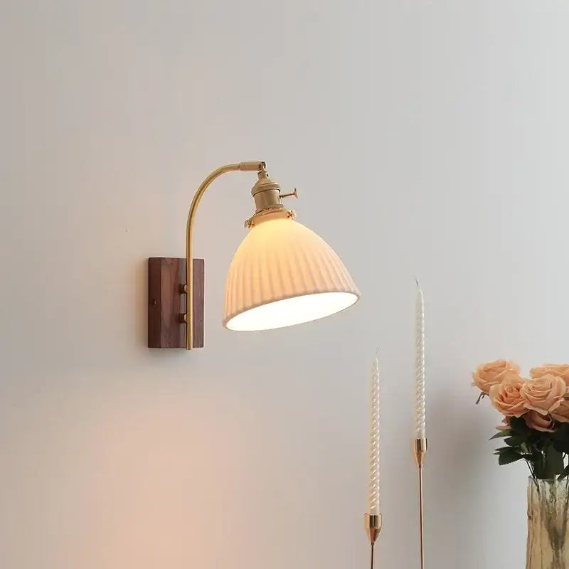 Antique brass wall lights with ribbed off-white glass shade and ceramic walnut led mounting plate for bedroom decorbites