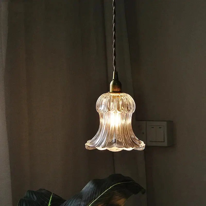 Clear ribbed glass pendant light with brass led fixture and twisted black cord for modern dining room decorbites brass led