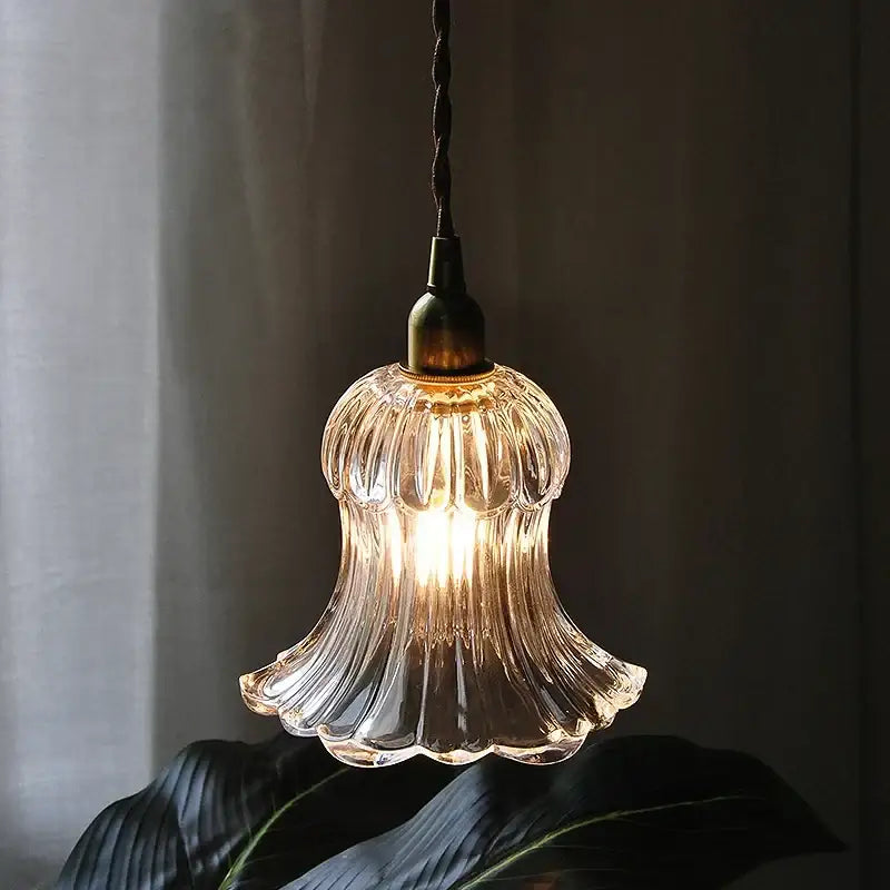 Modern ribbed glass brass led pendant light with clear glass and twisted black cord for dining room decorbites brass led