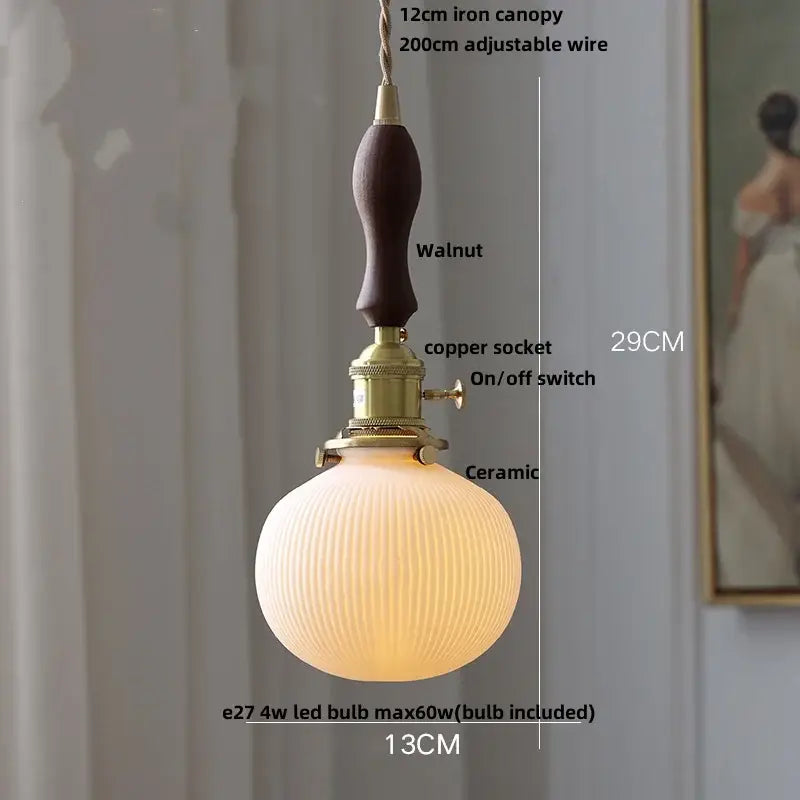 Modern ribbed ceramic led pendant lamp with warm finish, walnut iron canopy, and brass socket for dining room decorbites ceramic led