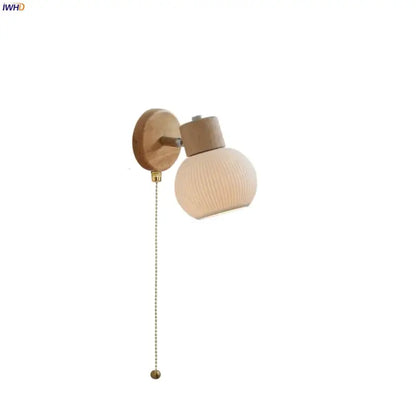 Modern ribbed glass ceramic led wall lights with warm-toned globe, wooden base, and brass pull chain decorbites ceramic led lamp