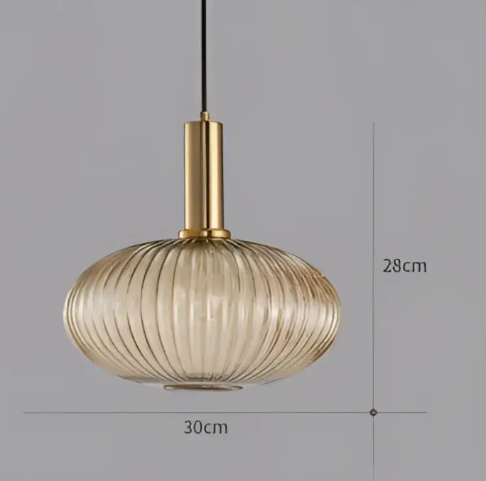A modern light chandelier featuring a gold metal fixture and translucent amber ribbed glass colorful led pendant