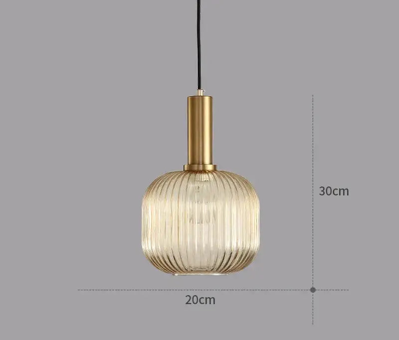 A modern light chandelier with a gold metal stem and ribbed translucent glass colorful led pendants for dining rooms