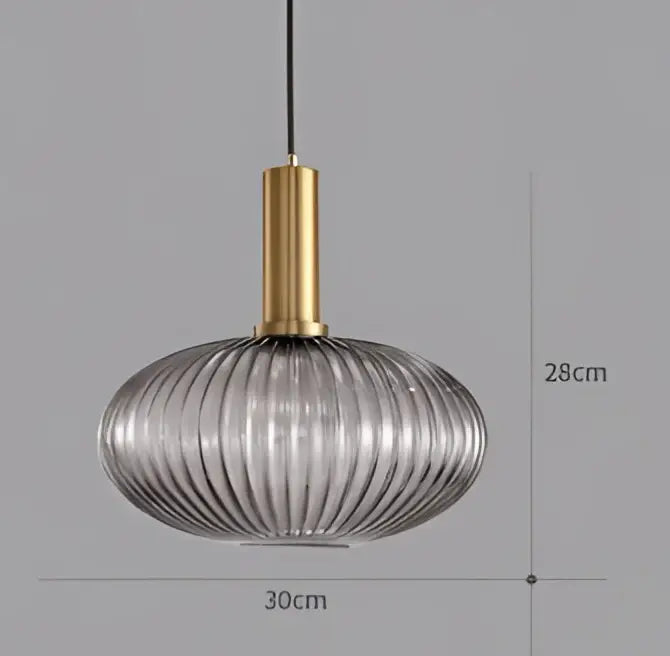 A modern pendant light chandelier with a gold metal stem and translucent ribbed glass colorful led shade