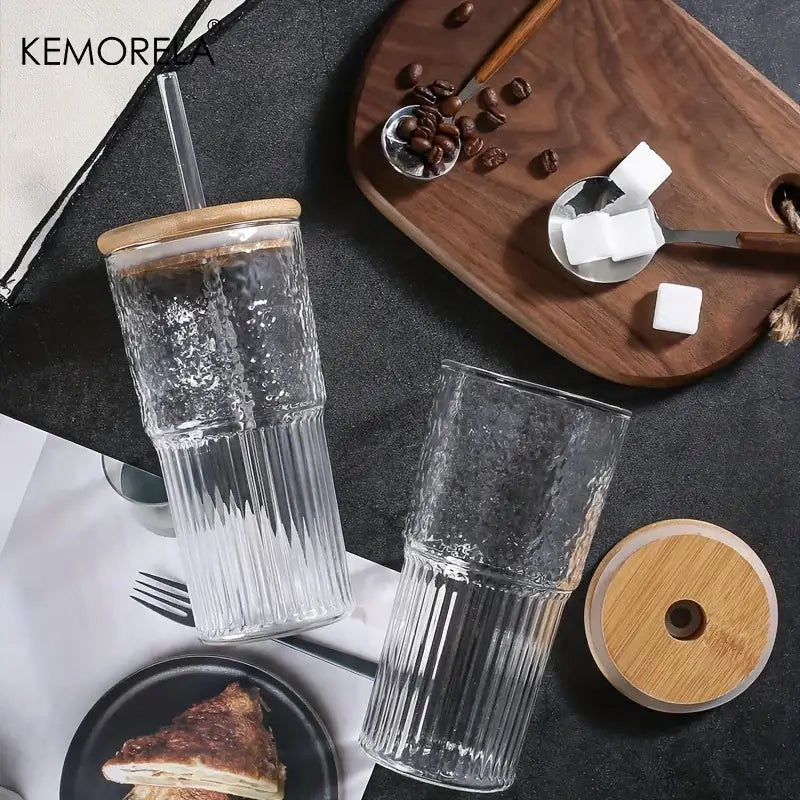 Modern ribbed glass cup set with clear vertical ribbed glass tumblers and bamboo lids including one with a straw