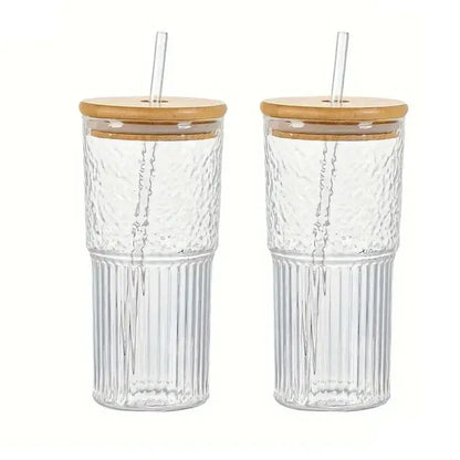 Modern ribbed glass cup with clear textured ribbed glass sides bamboo lid and clear straw for kitchen drinking use