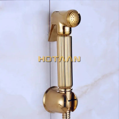 Modern ribbed gold brass bidet sprayer set with a gold-colored ribbed handheld shower nozzle and metallic finish