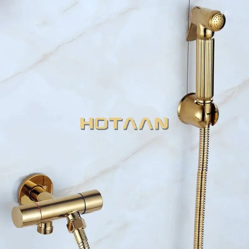 Modern ribbed gold brass bidet sprayer set with sleek handheld sprayer and flexible hose for bathroom hygiene use