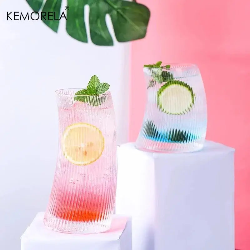 Modern ribbed sail-shaped glass cups with clear ribbed design and colorful gradient interiors for stylish dining decorbites glass cups