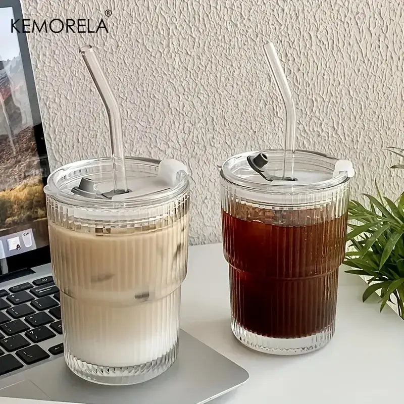 Clear ribbed stripe glass cup with white silicone lid and transparent curved straw by kemorela for modern kitchen use
