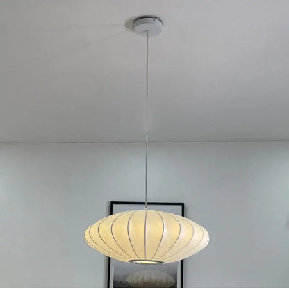 Cream-colored ribbed pendant lamp with sleek metallic chain and ceiling mount decorbites elegant silk designer lighting