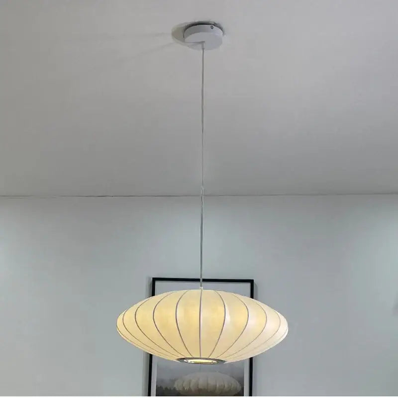 Cream-colored ribbed pendant lamp with sleek metallic chain and ceiling mount decorbites elegant silk designer lighting