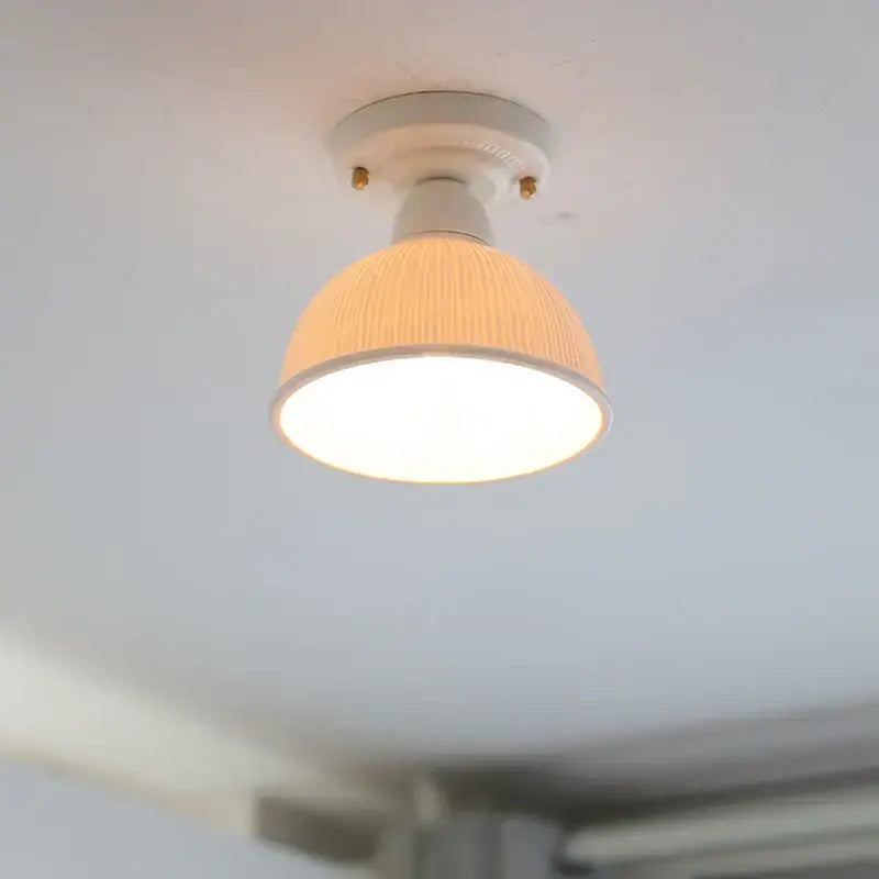Modern ridged cream ceramic led ceiling light with warm-toned ribbed fabric shade and brass screws for decorbites ceramic led ceiling