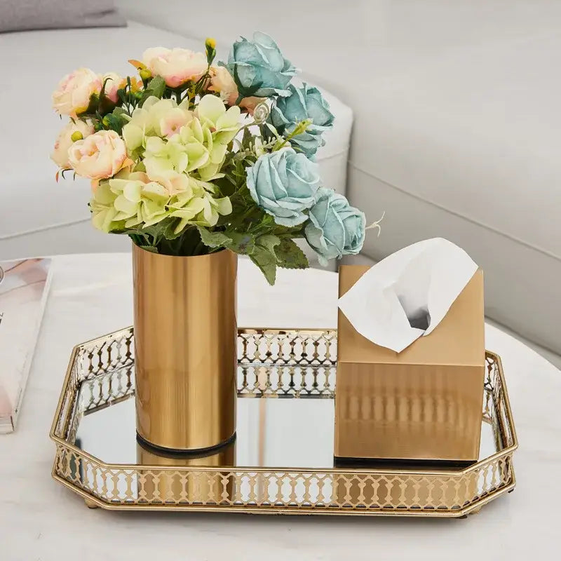 Modern ridged decorbites gold plated cylinder vase in gold holding artificial pink green and blue flowers for living room decor