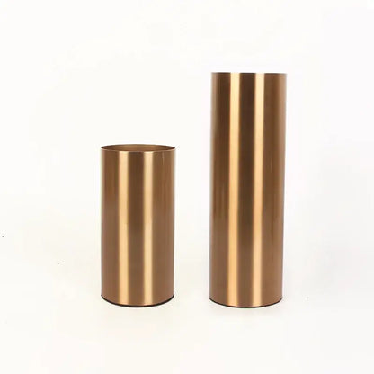 Two brushed gold plated cylinder vases with a ridged design for modern living room decor by decorbites gold plated