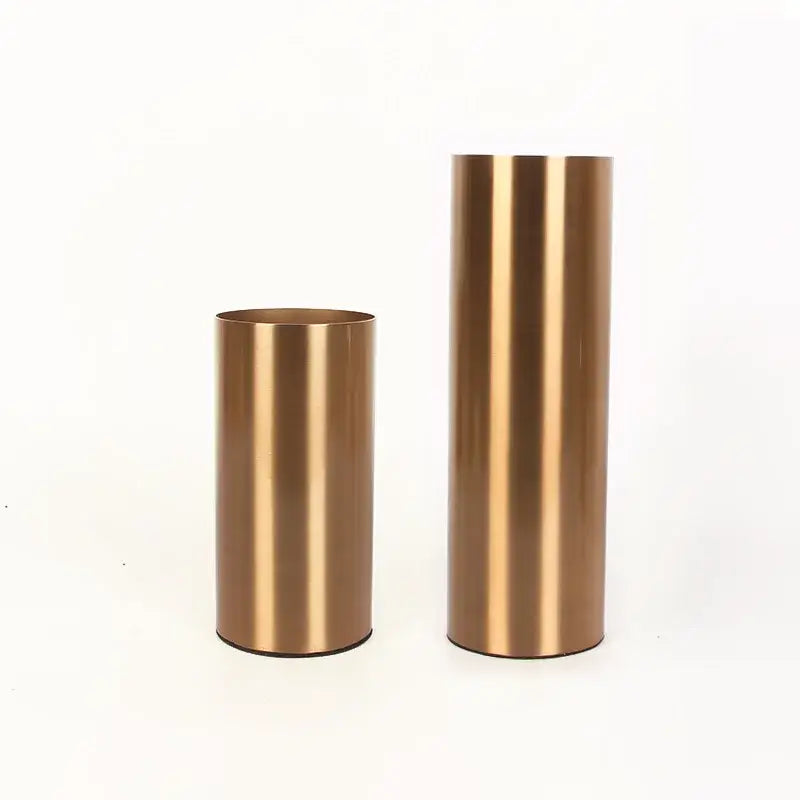 Two brushed gold plated cylinder vases with a ridged design for modern living room decor by decorbites gold plated