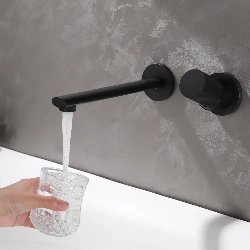 Modern rose gold aitana wall-mounted bathroom faucet with black matte finish knob and high-quality ceramic valve core