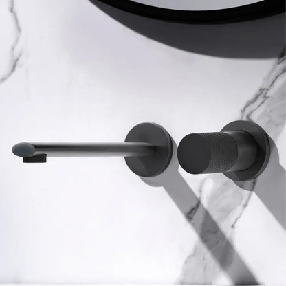 Black matte wall-mounted toilet paper holder with textured handle complementing modern rose gold aitana wall-mounted faucet with ceramic valve core