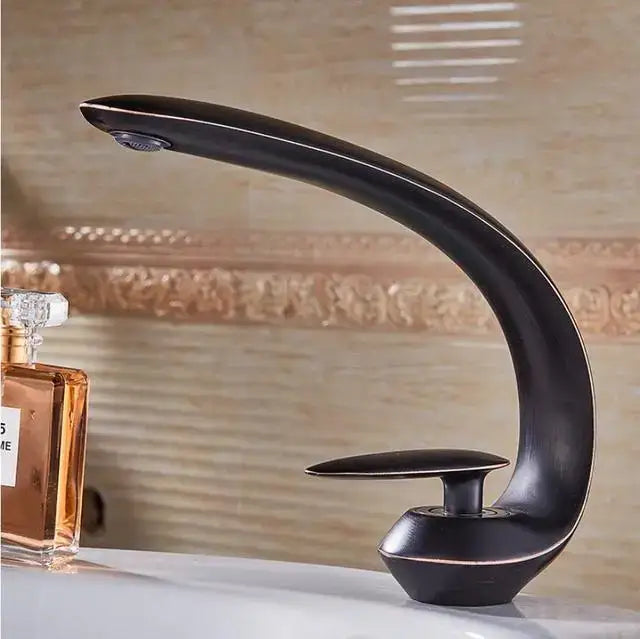 Modern rose gold and black brass decorbites basin faucet with sleek curved design and single handle for bathroom use