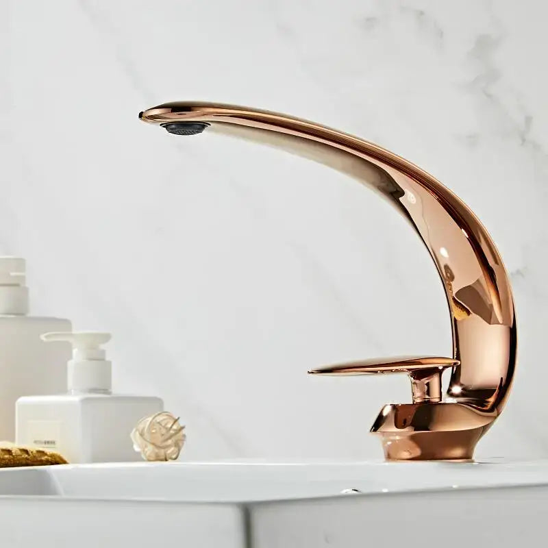 Modern rose gold and black brass decorbites basin faucet with single handle and sleek curved spout for bathroom use