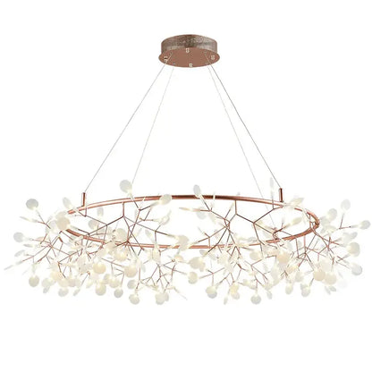 Modern rose gold pendant light with copper-toned branch arms and frosted glass light sources for dining room