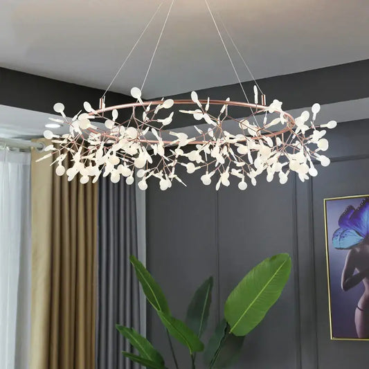 A modern rose gold pendant light with copper tones and white glass leaf shapes as light sources for dining rooms