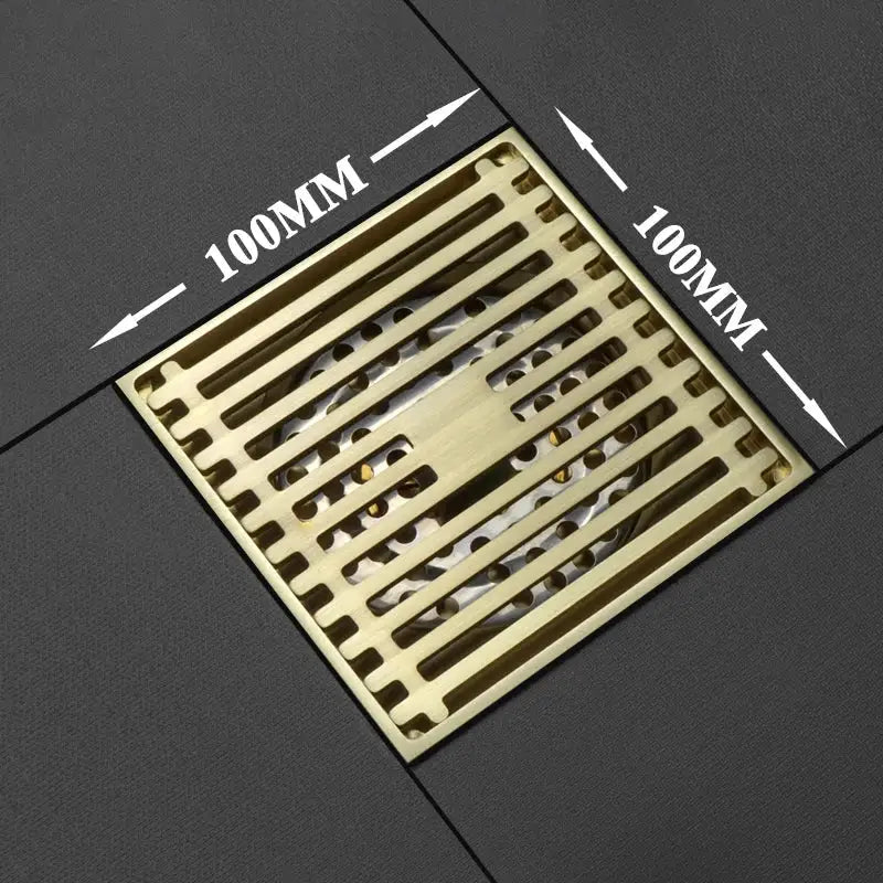 Modern rose gold brushed square floor drain with brass-colored metal grid pattern for bathroom use 100mm x 100mm