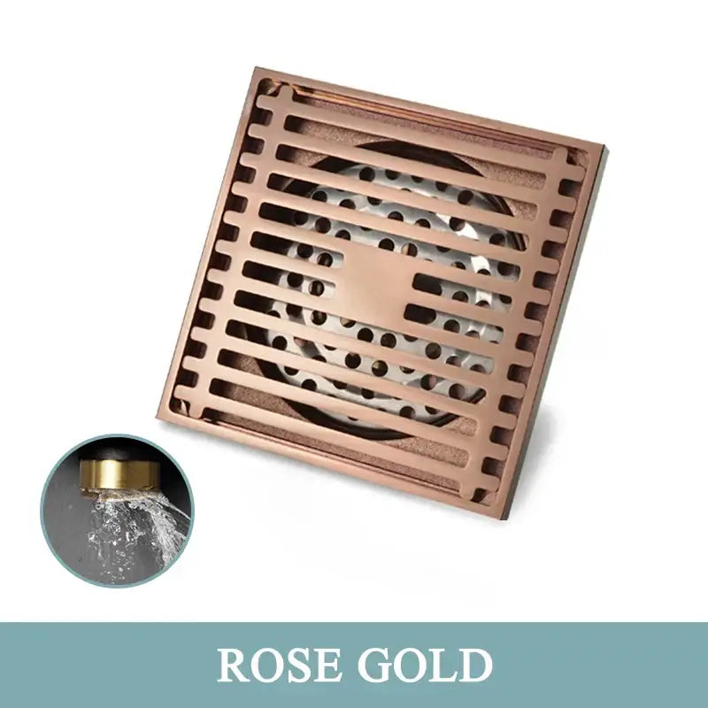 Modern rose gold brushed square floor drain with slatted design and perforated center for bathroom use